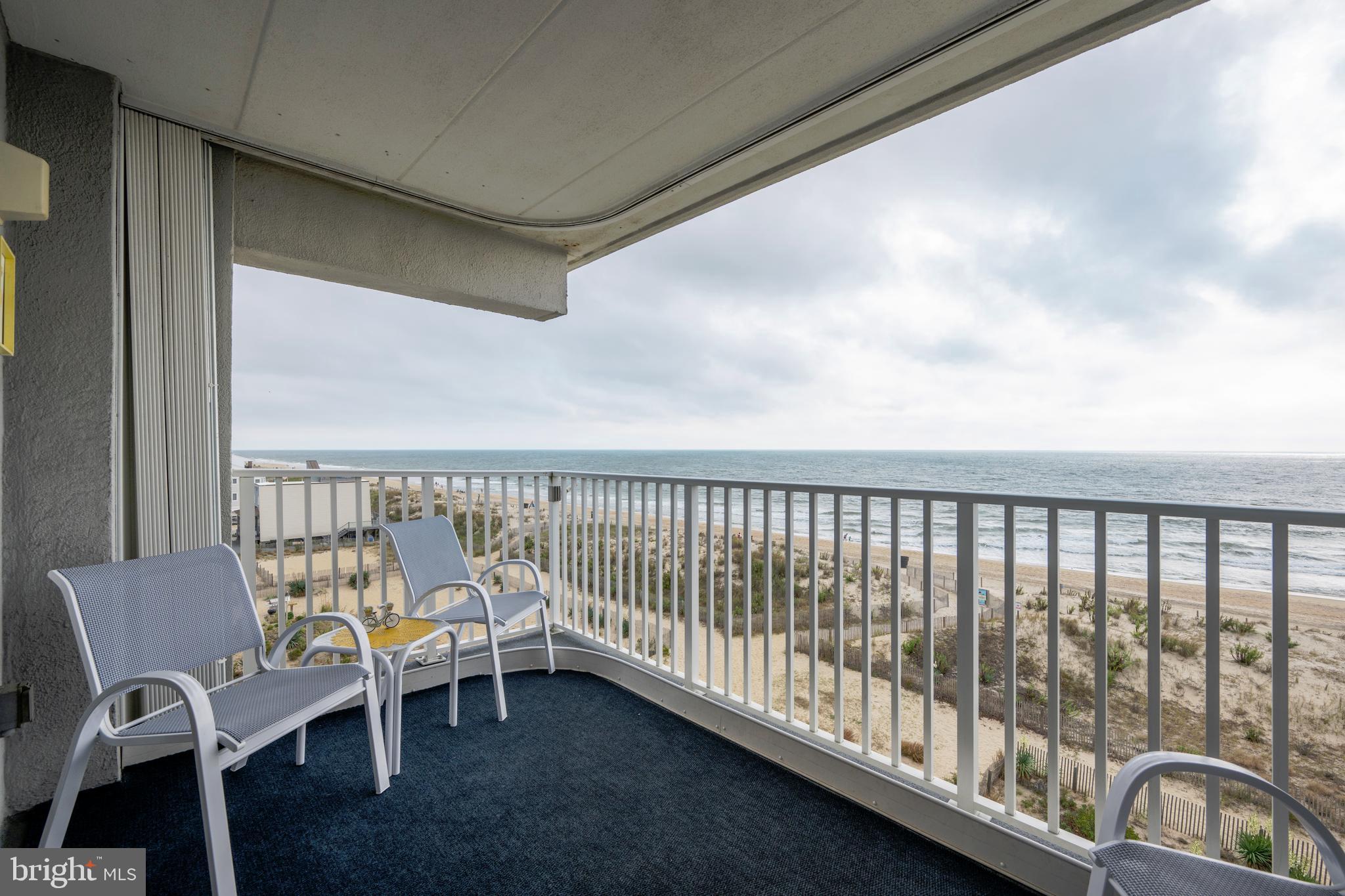 5 77th Street, Unit 404 Ocean City, MD 21842 - Photo 5 of 28 a balcony with chairs