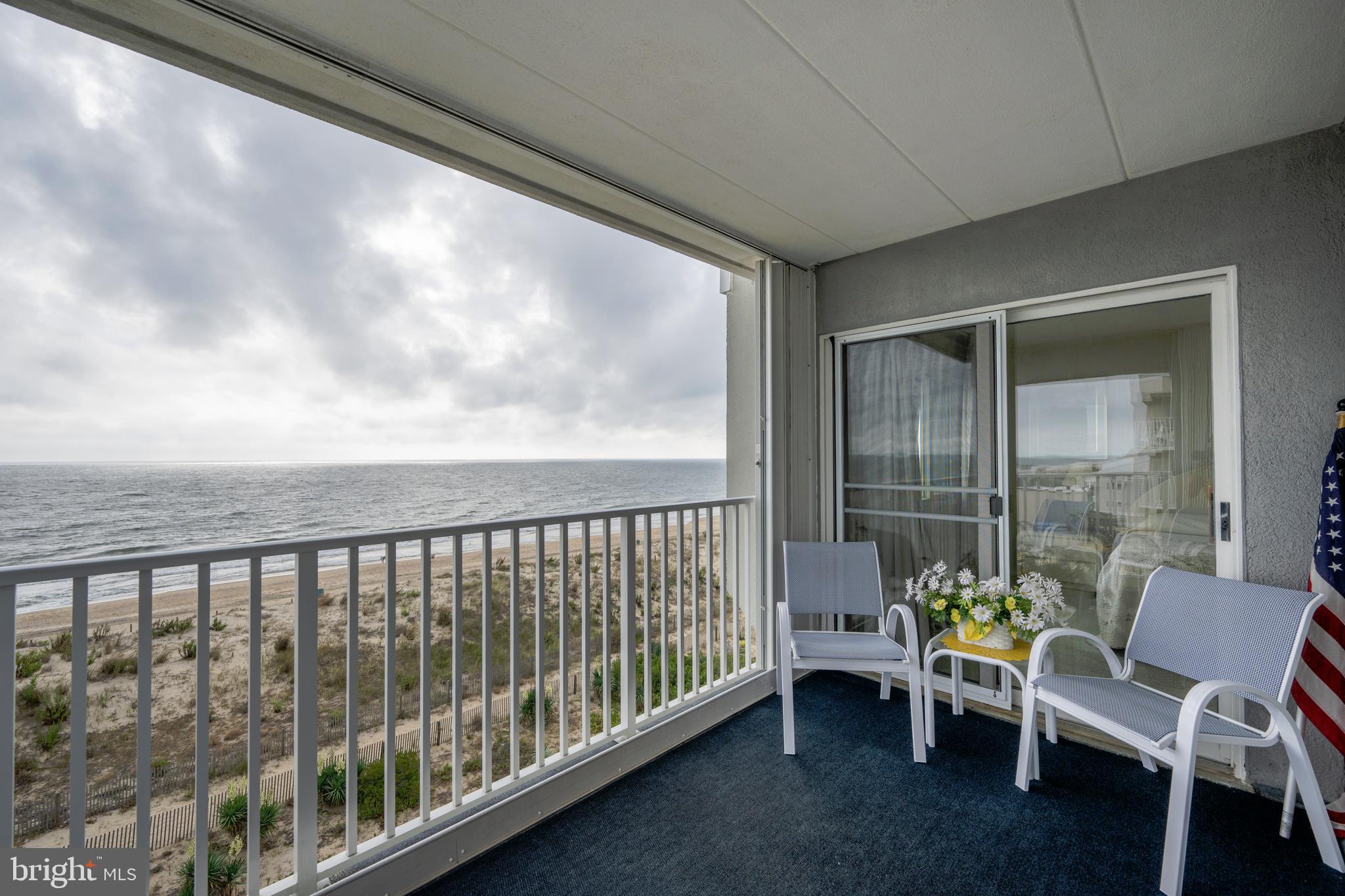5 77th Street, Unit 404 Ocean City, MD 21842 - Photo 6 of 28 a view of a porch with furniture