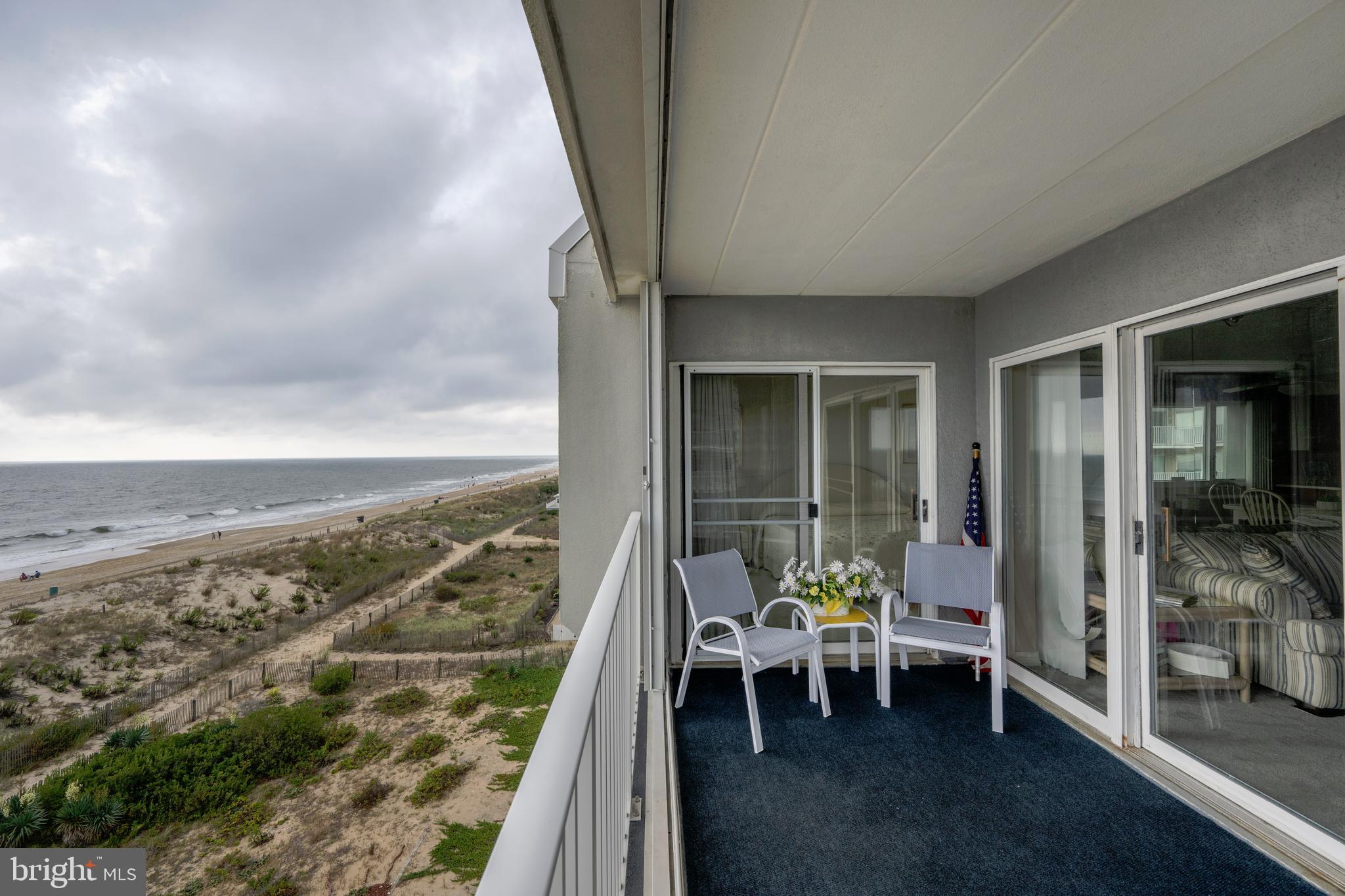 5 77th Street, Unit 404 Ocean City, MD 21842 - Photo 7 of 28 a view of balcony with chairs and a table