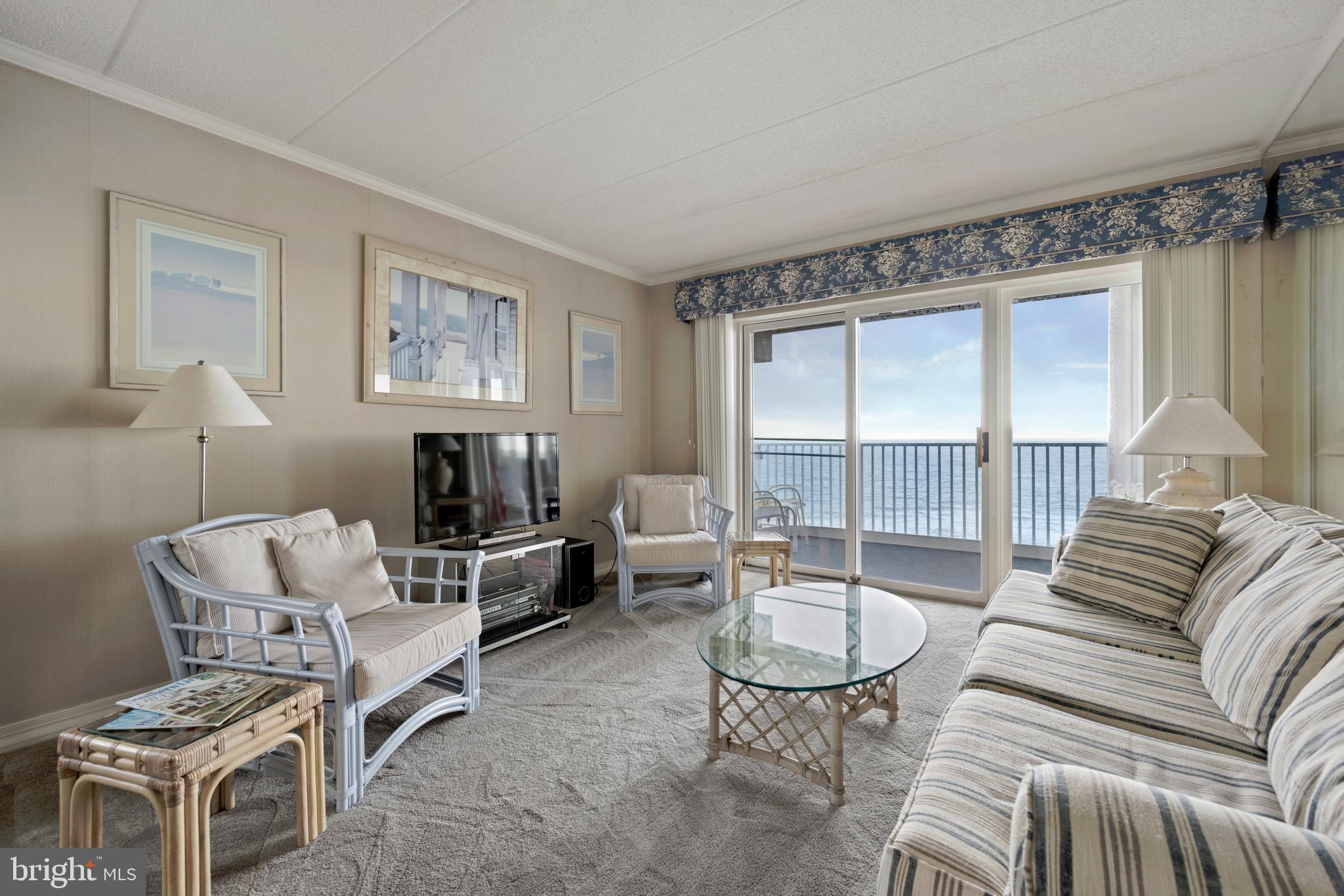 5 77th Street, Unit 404 Ocean City, MD 21842 - Photo 10 of 28 a living room with furniture and a large window