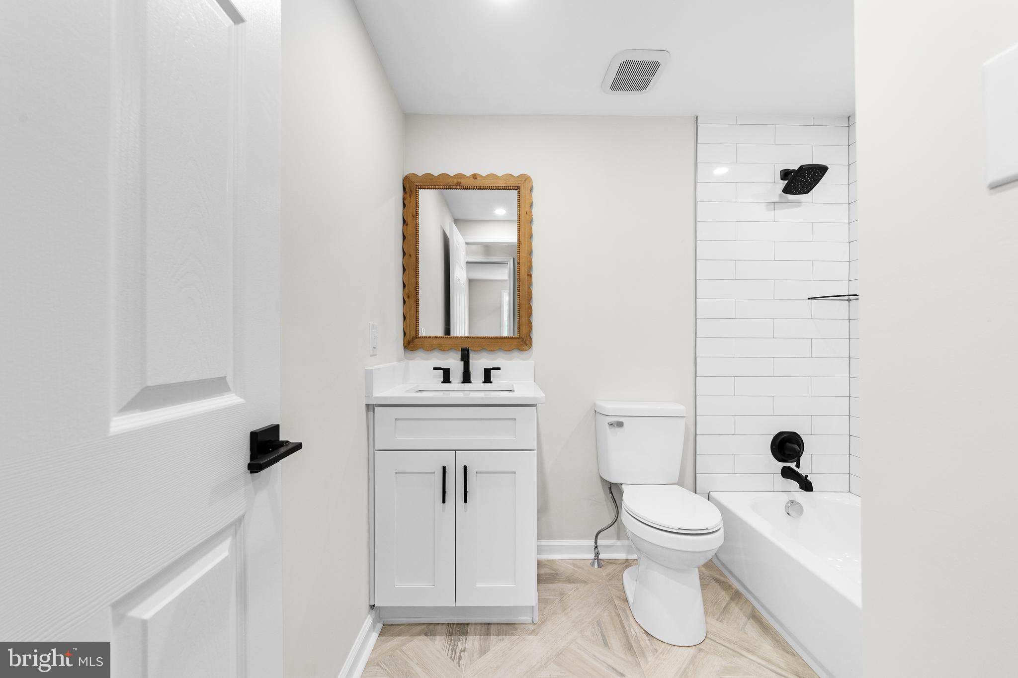 15 Dunlin Way Sicklerville, NJ 08081 - Photo 24 of 28 a bathroom with a toilet sink and mirror