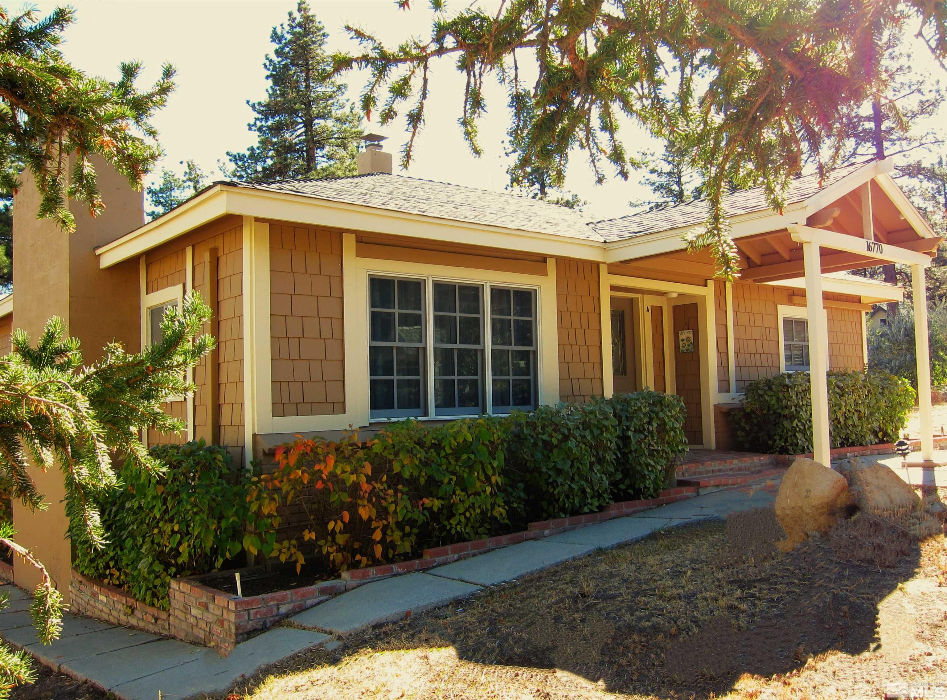 16770 Mt Rose Highway, Unit A & B Reno, NV 89511 - Photo 1 of 40 a front view of a house with garden