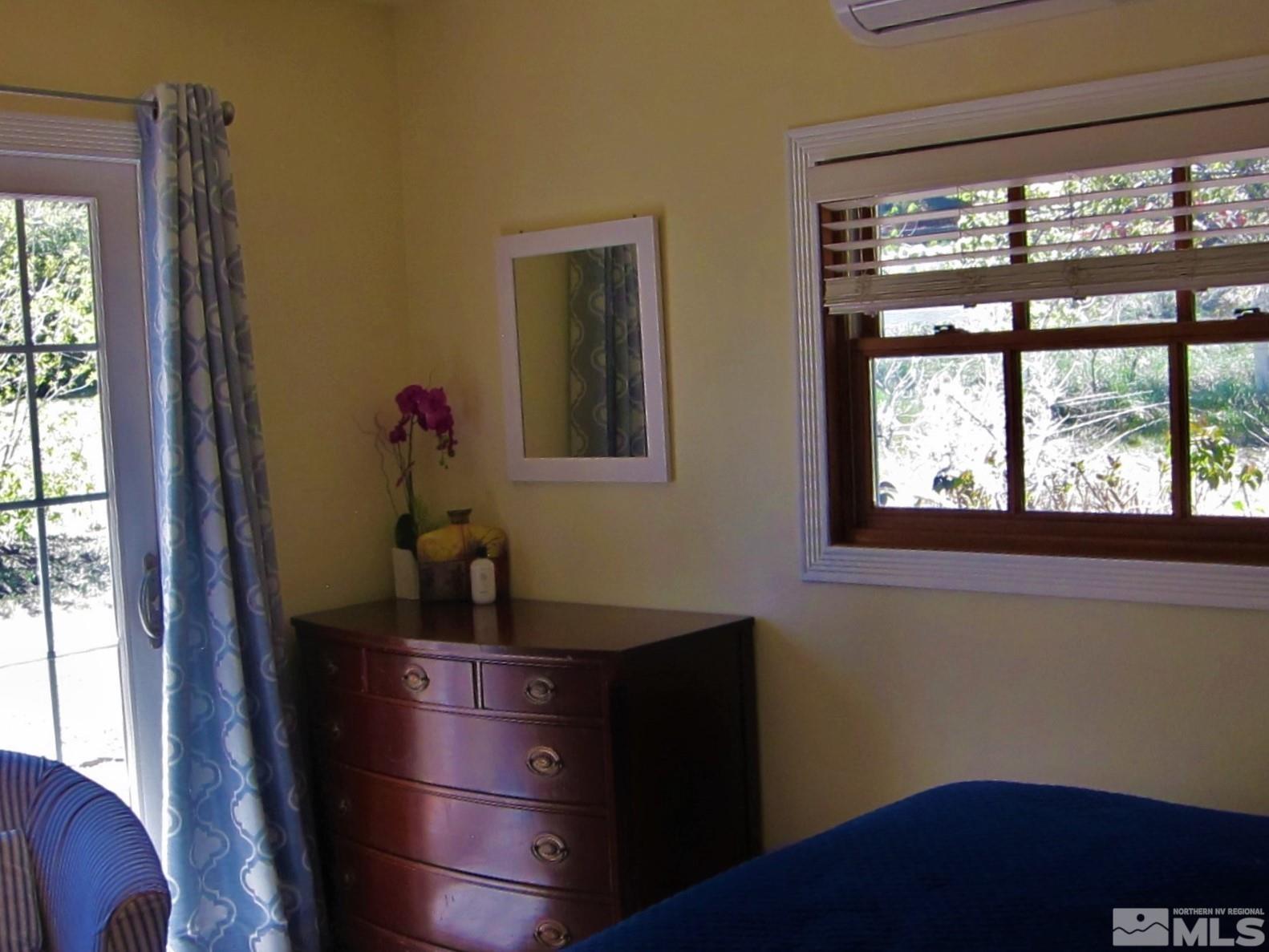 16770 Mt Rose Highway, Unit A & B Reno, NV 89511 - Photo 19 of 40 a room with a window and furniture