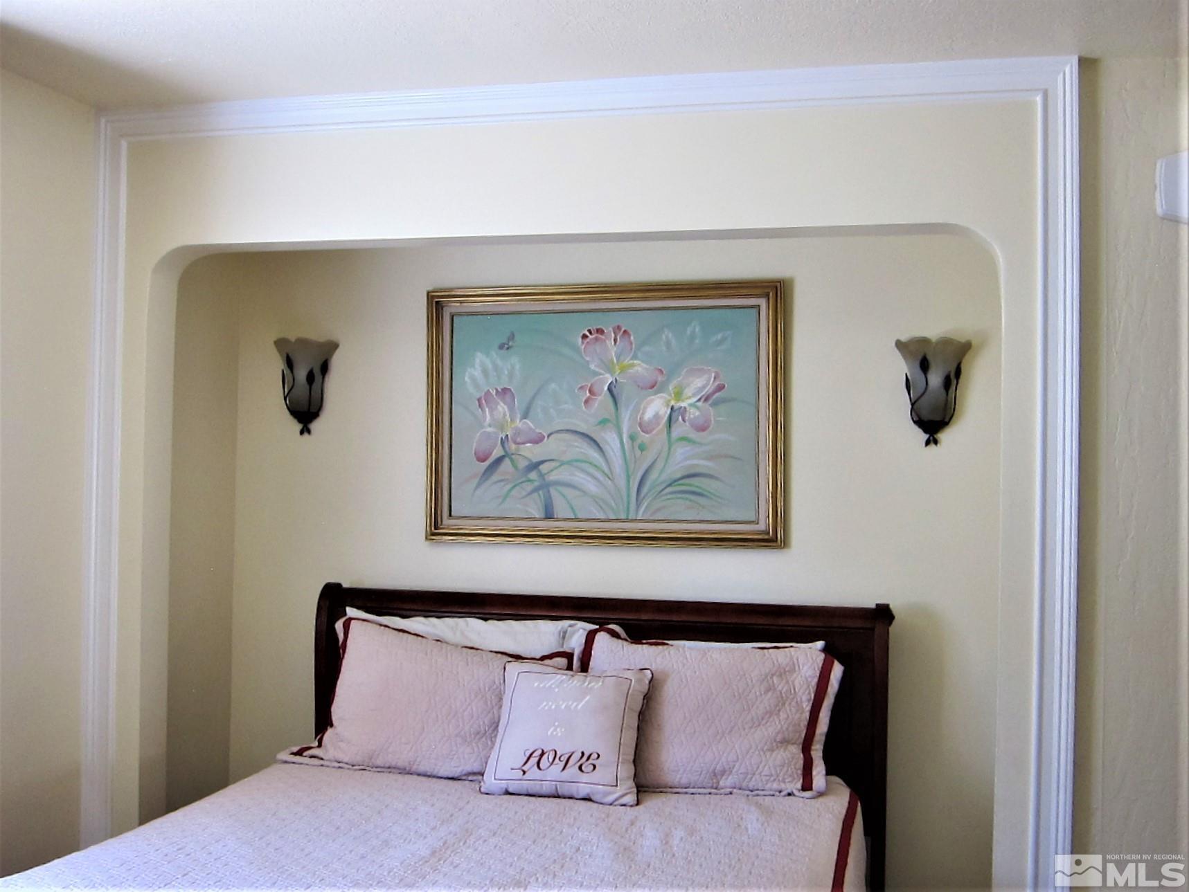 16770 Mt Rose Highway, Unit A & B Reno, NV 89511 - Photo 20 of 40 a bedroom with a bed and painting on the wall