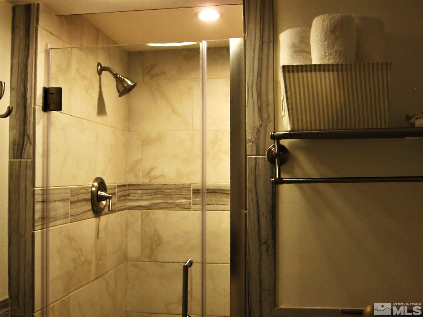 16770 Mt Rose Highway, Unit A & B Reno, NV 89511 - Photo 22 of 40 a bathroom with a shower