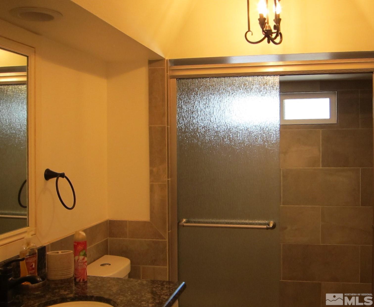16770 Mt Rose Highway, Unit A & B Reno, NV 89511 - Photo 32 of 40 a bathroom with a shower and a sink