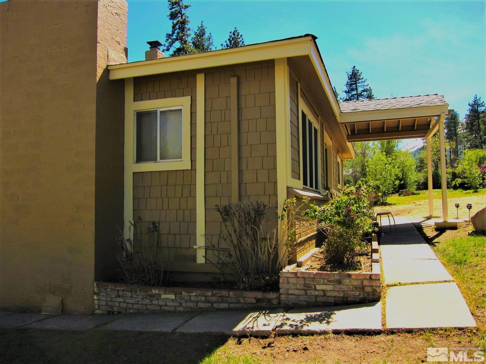 16770 Mt Rose Highway, Unit A & B Reno, NV 89511 - Photo 35 of 40 a front view of a house with garden
