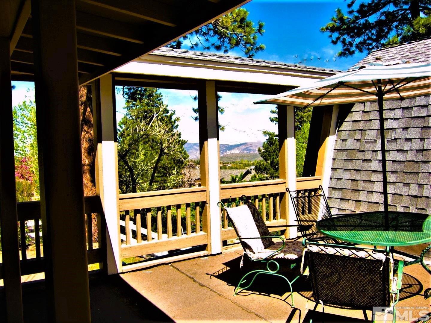 16770 Mt Rose Highway, Unit A & B Reno, NV 89511 - Photo 9 of 40 a roof deck with table and chairs and potted plants