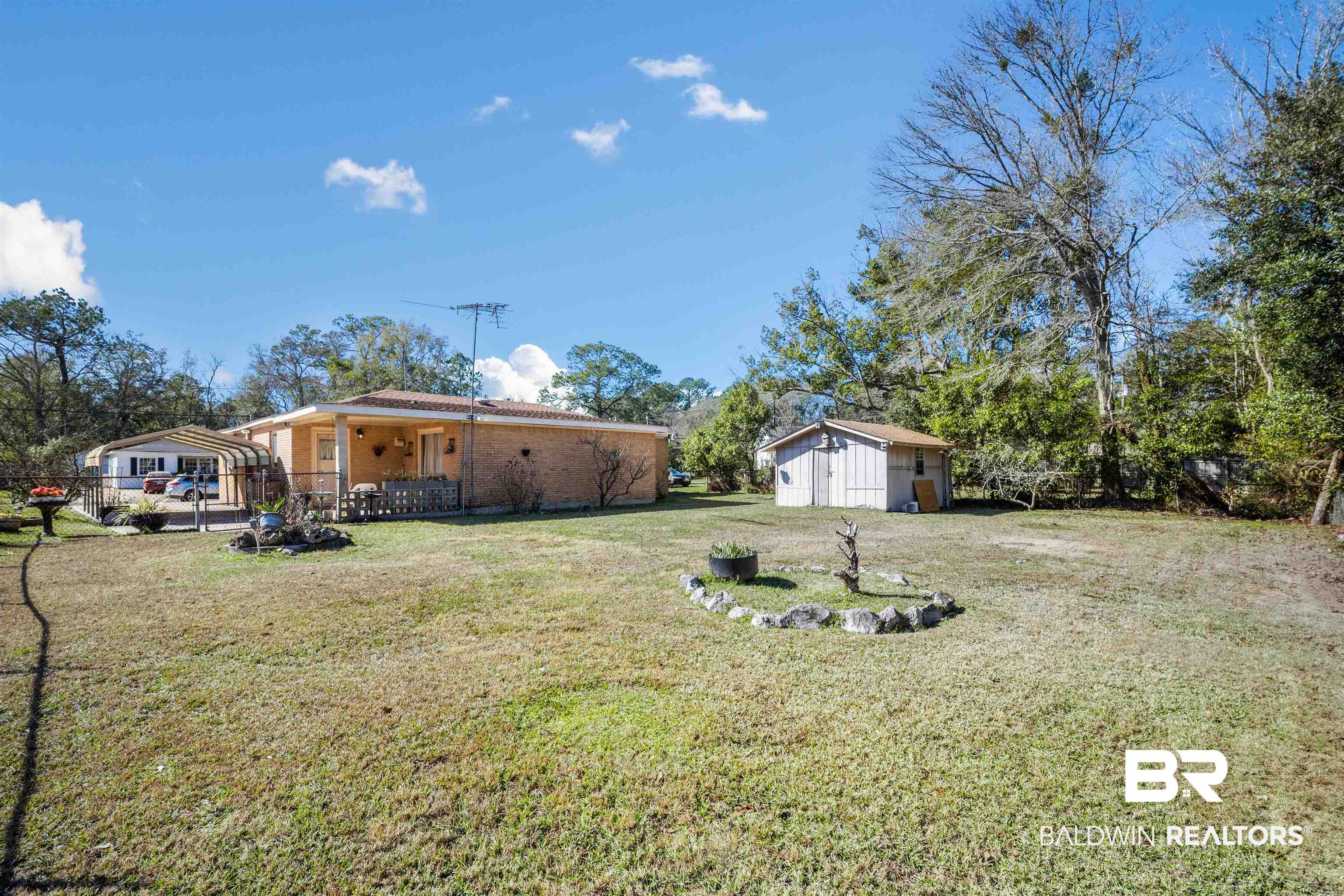 2618 Serigny Drive Mobile, AL 36605 - Photo 22 of 25 View of yard with an outbuilding and a patio area