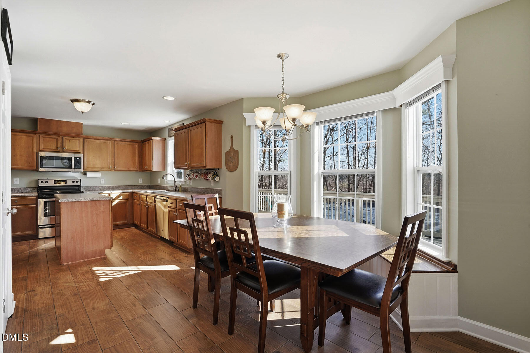 90 Spring Leaf Lane Wendell, NC 27591 - Photo 11 of 37 a view of a dining room with furniture window and wooden floor