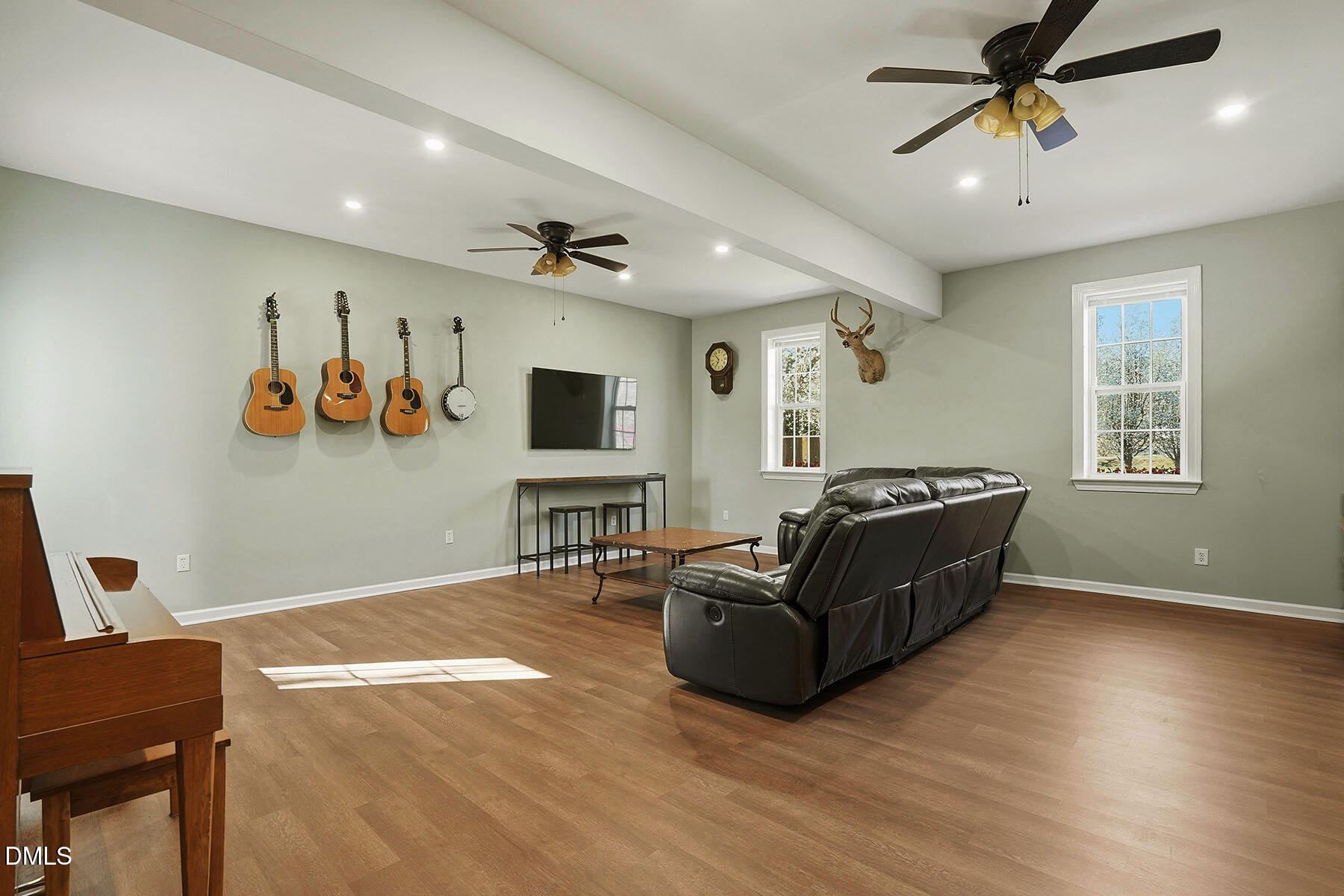 90 Spring Leaf Lane Wendell, NC 27591 - Photo 15 of 37 a living room with furniture and a flat screen tv with wooden floor