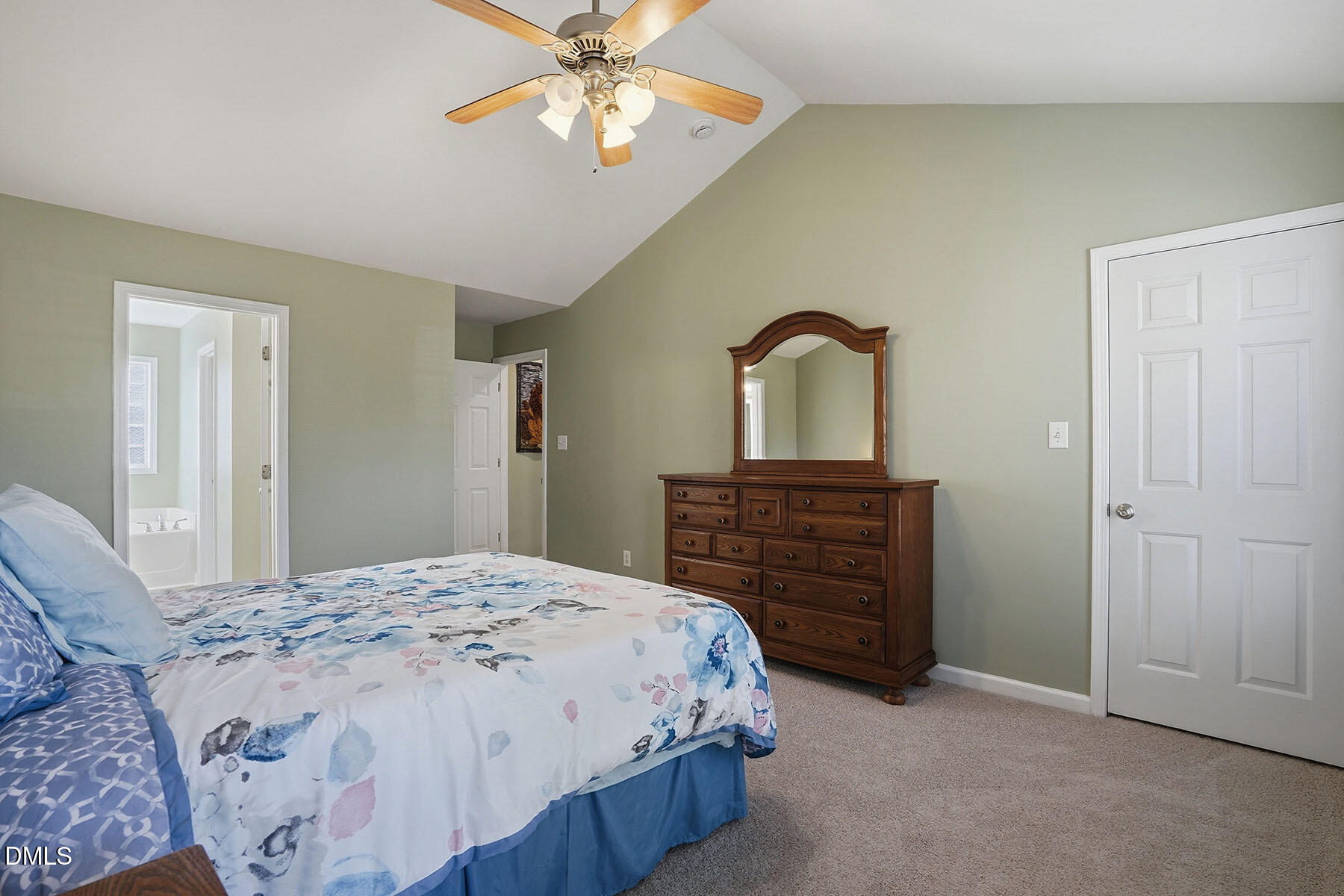 90 Spring Leaf Lane Wendell, NC 27591 - Photo 18 of 37 a bedroom with a bed and a dresser