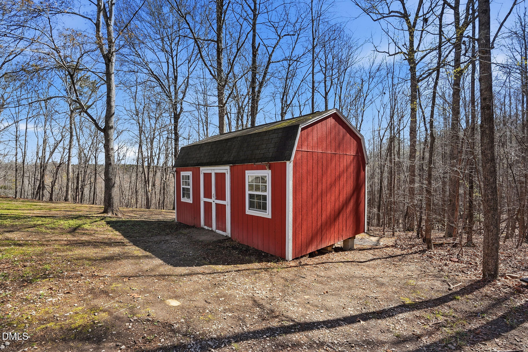 90 Spring Leaf Lane Wendell, NC 27591 - Photo 29 of 37 a view of a barn with a yard and large trees