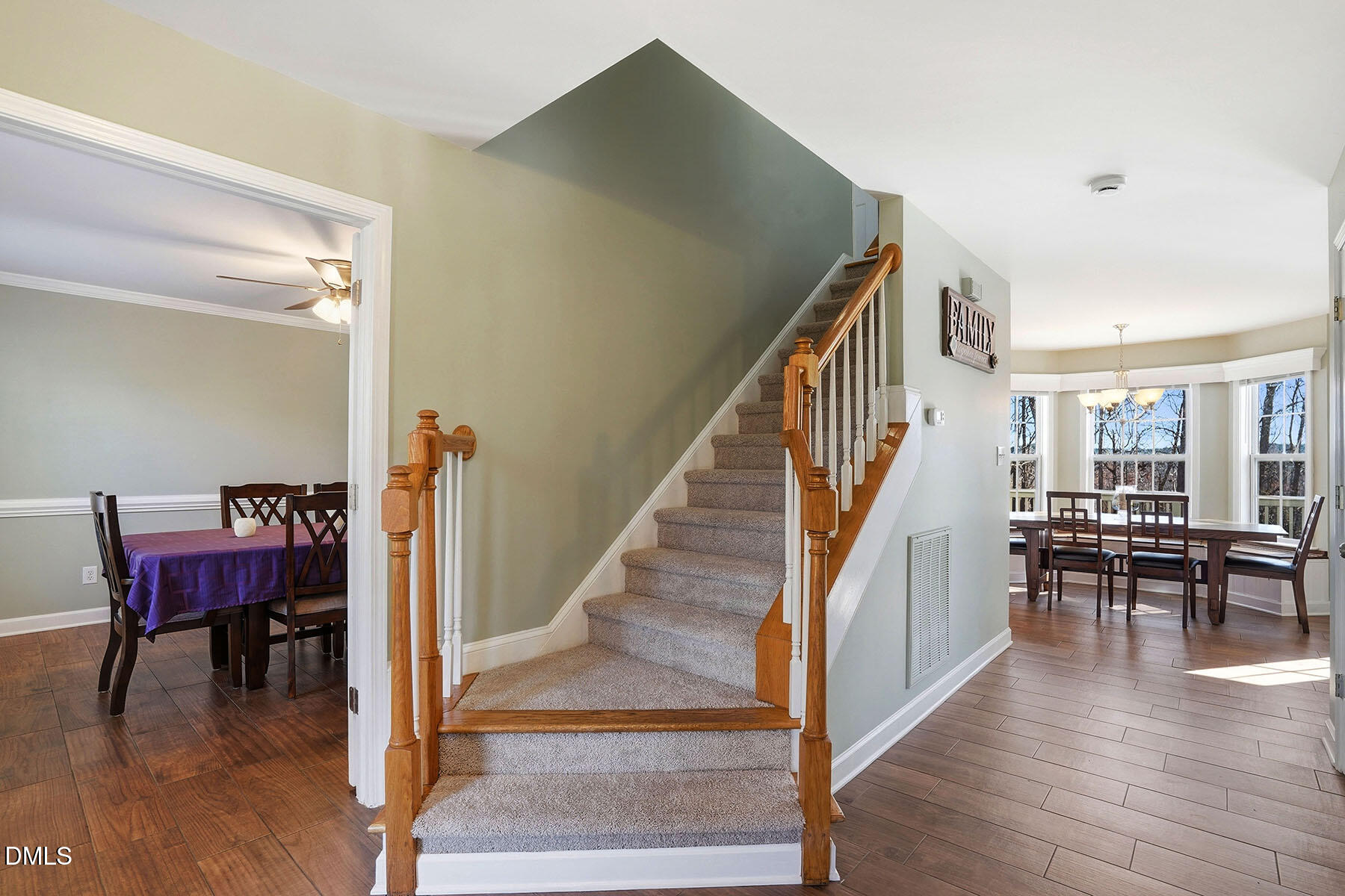 90 Spring Leaf Lane Wendell, NC 27591 - Photo 4 of 37 a view of a livingroom with furniture wooden floor and stairs