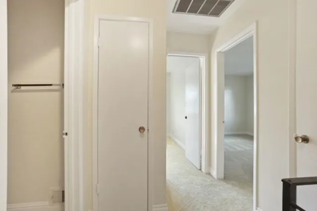 a view of a bathroom with a glass door