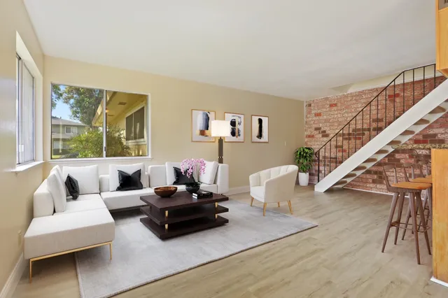 a living room with furniture or couch and a wooden floor