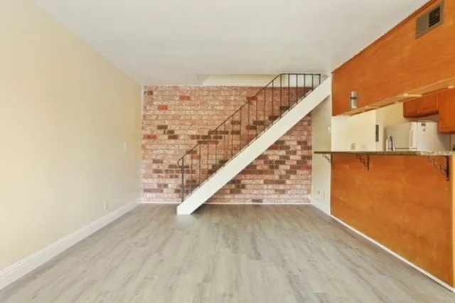 a view of entryway with wooden floor