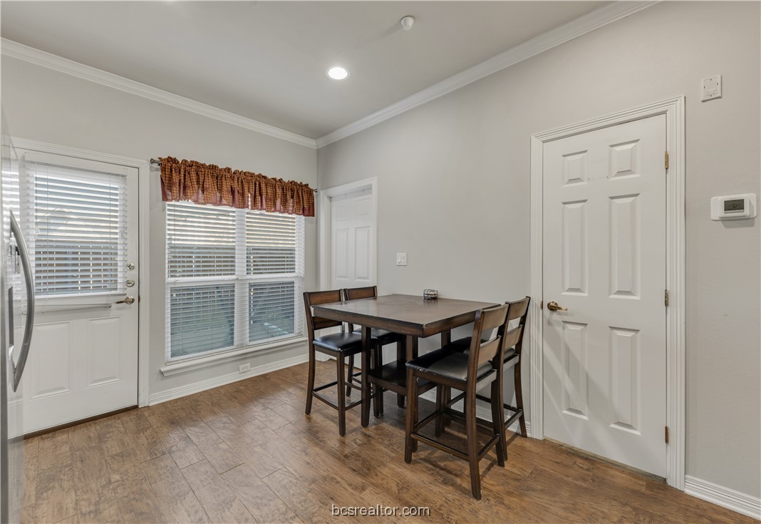 1198 Jones-Butler Road, Unit 1807 College Station, TX 77840 - Photo 14 of 24 a view of a dining room with furniture and a window