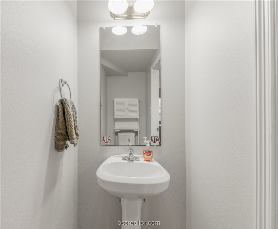 1198 Jones-Butler Road, Unit 1807 College Station, TX 77840 - Photo 17 of 24 a bathroom with a sink and a mirror