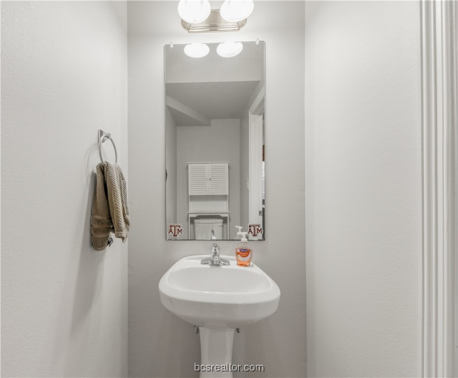 1198 Jones-Butler Road, Unit 1807 College Station, TX 77840 - Photo 17 of 24 a bathroom with a sink and a mirror