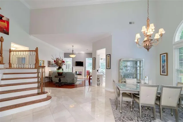 a living room with furniture chandelier and a chandelier