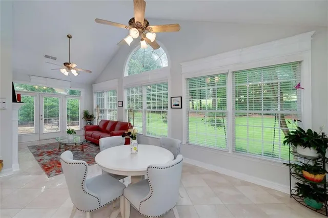 a living room with patio area and balcony view