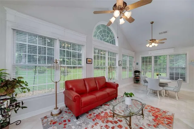a living room with furniture and a large window