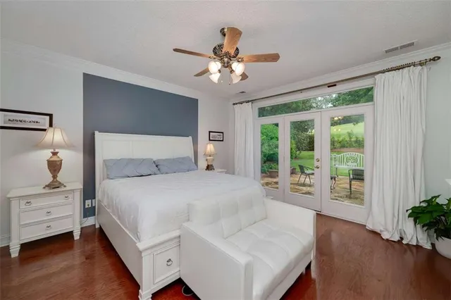 a bedroom with a large bed and a window