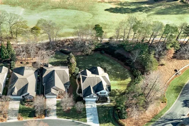 a view of building with yard and outdoor seating