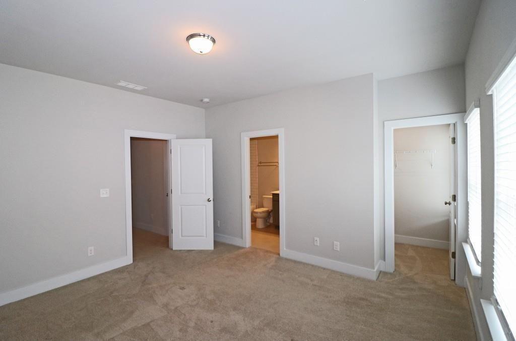 2163 Wiggins Walk Atlanta, GA 30316 - Photo 12 of 22 an empty room with closet and a bathroom
