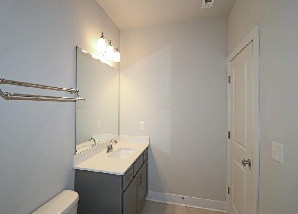 2163 Wiggins Walk Atlanta, GA 30316 - Photo 13 of 22 a bathroom with a sink toilet and shower