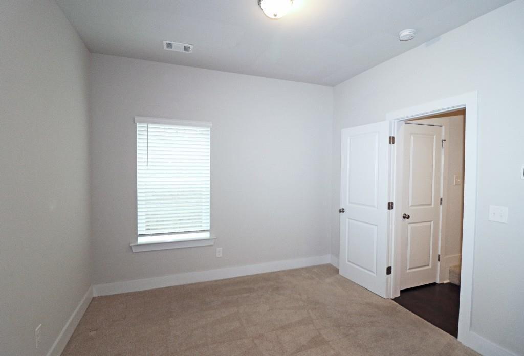 2163 Wiggins Walk Atlanta, GA 30316 - Photo 17 of 22 an empty room with windows and closet