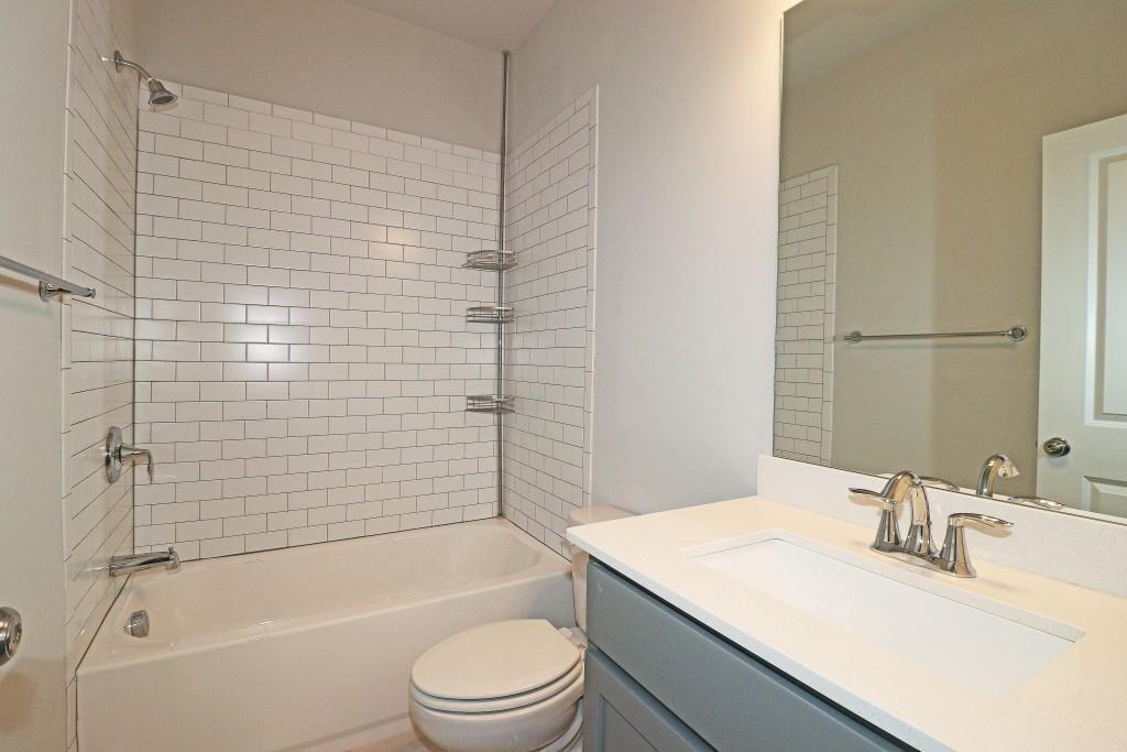 2163 Wiggins Walk Atlanta, GA 30316 - Photo 18 of 22 a bathroom with a granite countertop sink toilet and shower