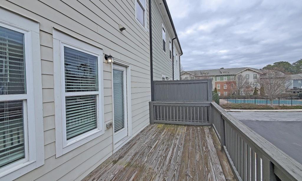 2163 Wiggins Walk Atlanta, GA 30316 - Photo 19 of 22 a view of balcony with wooden floor and fence