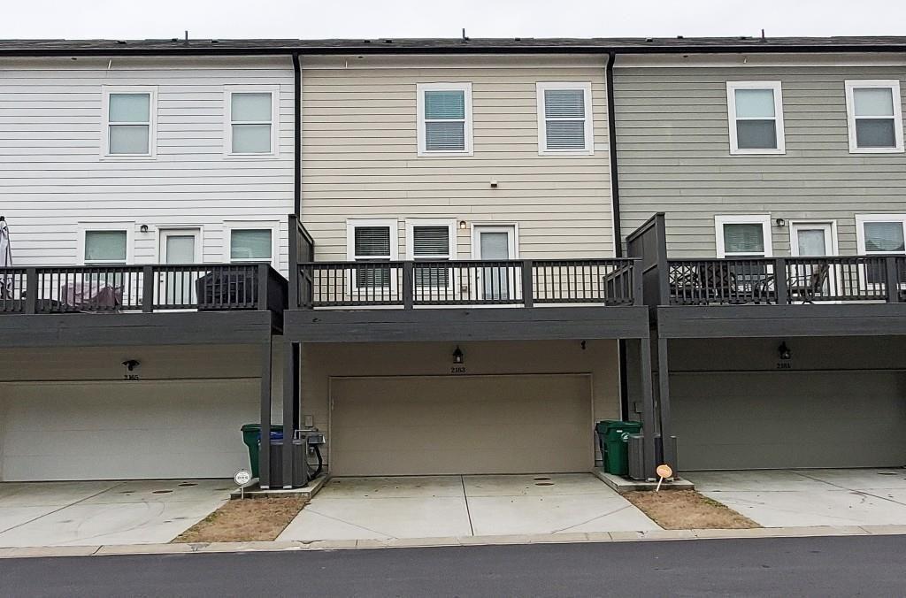 2163 Wiggins Walk Atlanta, GA 30316 - Photo 20 of 22 a front view of a house with garage