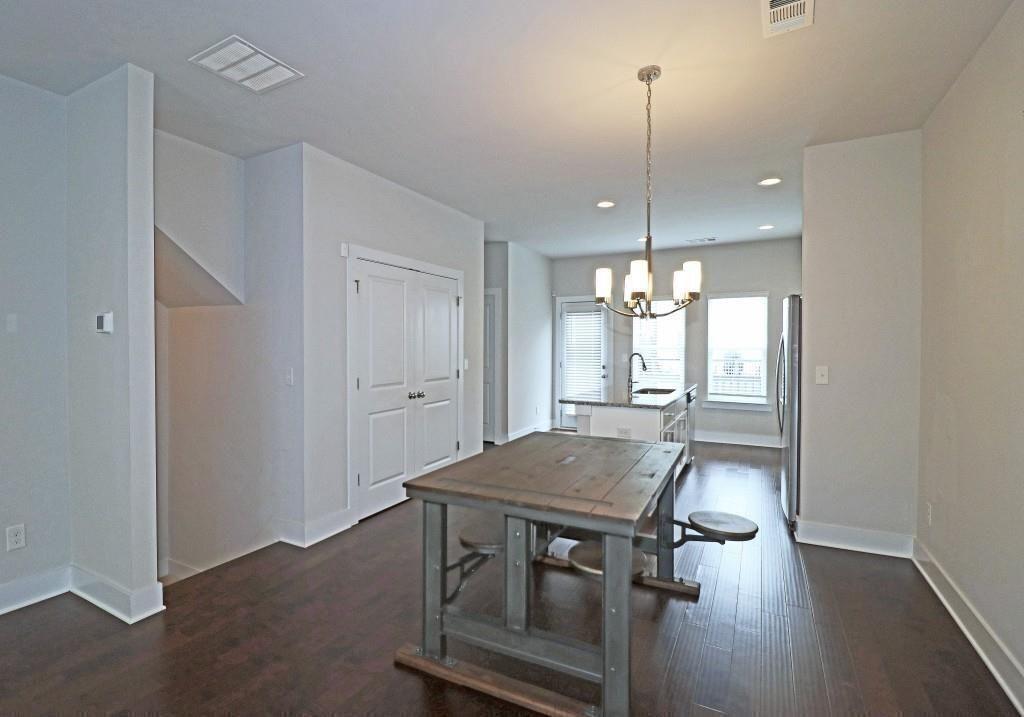2163 Wiggins Walk Atlanta, GA 30316 - Photo 4 of 22 a view of a dining room with furniture window and wooden floor