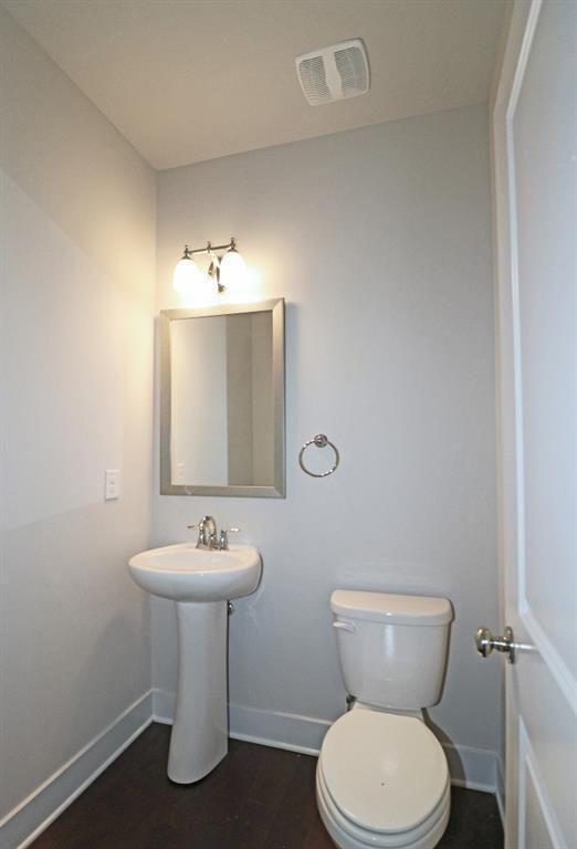2163 Wiggins Walk Atlanta, GA 30316 - Photo 7 of 22 a bathroom with a sink toilet and a mirror