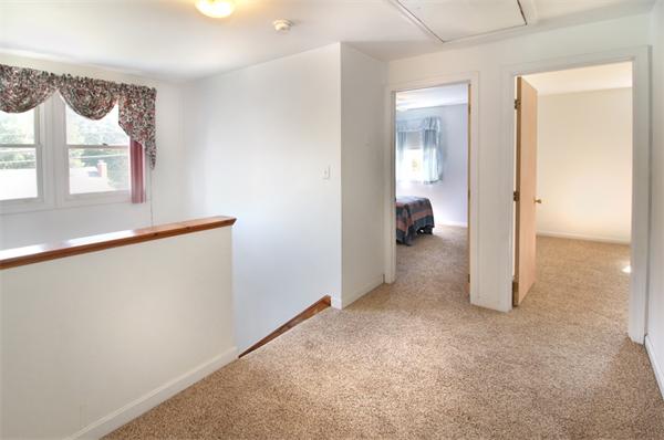 14 Samoset Road Woburn, MA 01801 - Photo 11 of 25 an empty room and a window with wooden floor