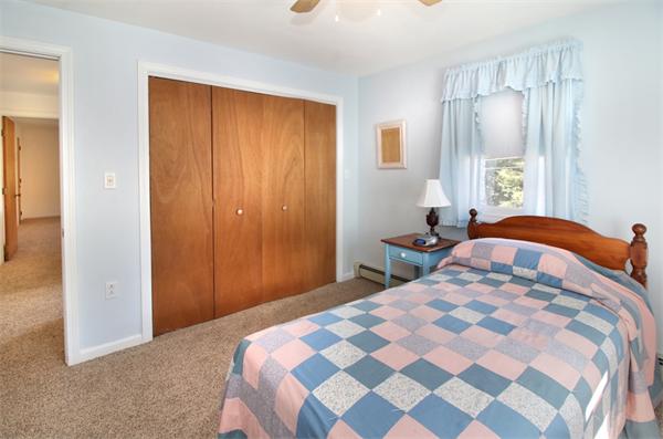 14 Samoset Road Woburn, MA 01801 - Photo 17 of 25 a bedroom with a bed and a window