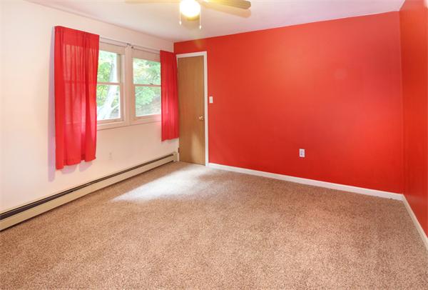 14 Samoset Road Woburn, MA 01801 - Photo 18 of 25 an empty room with windows lake and mountain view