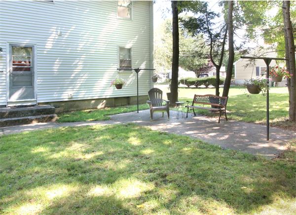 14 Samoset Road Woburn, MA 01801 - Photo 22 of 25 a view of yard with a table and chairs
