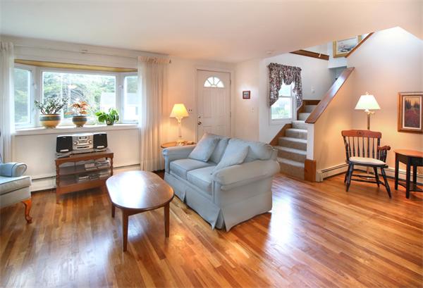14 Samoset Road Woburn, MA 01801 - Photo 3 of 25 a living room with furniture and a wooden floor