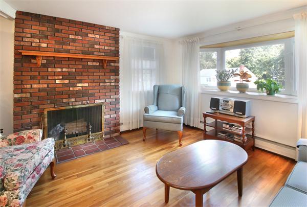 14 Samoset Road Woburn, MA 01801 - Photo 4 of 25 a living room with furniture and a fireplace