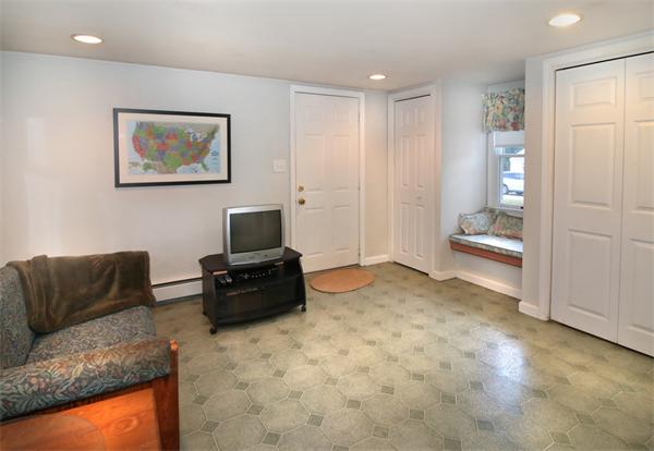 14 Samoset Road Woburn, MA 01801 - Photo 5 of 25 a living room with furniture and a flat screen tv