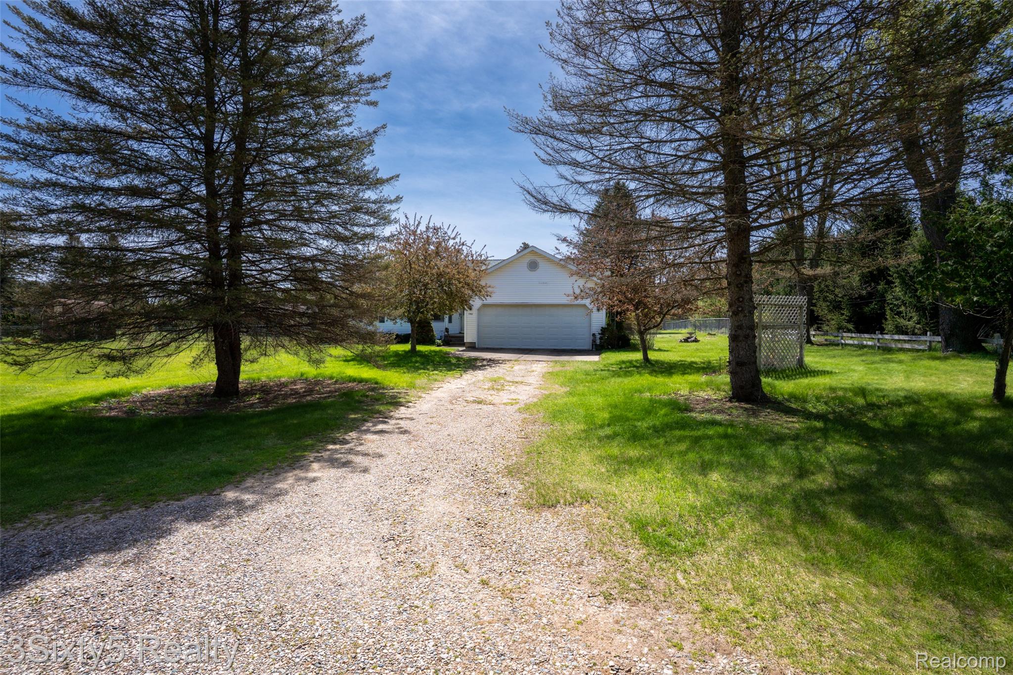 1783 Farnsworth Road Lapeer, MI 48446 - Photo 1 of 51 View of front facade featuring driveway, a front yard, and an outdoor structure