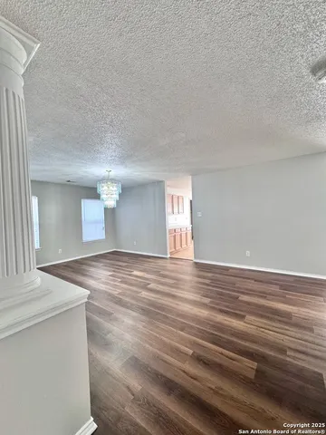 a view of a room that has a window in it