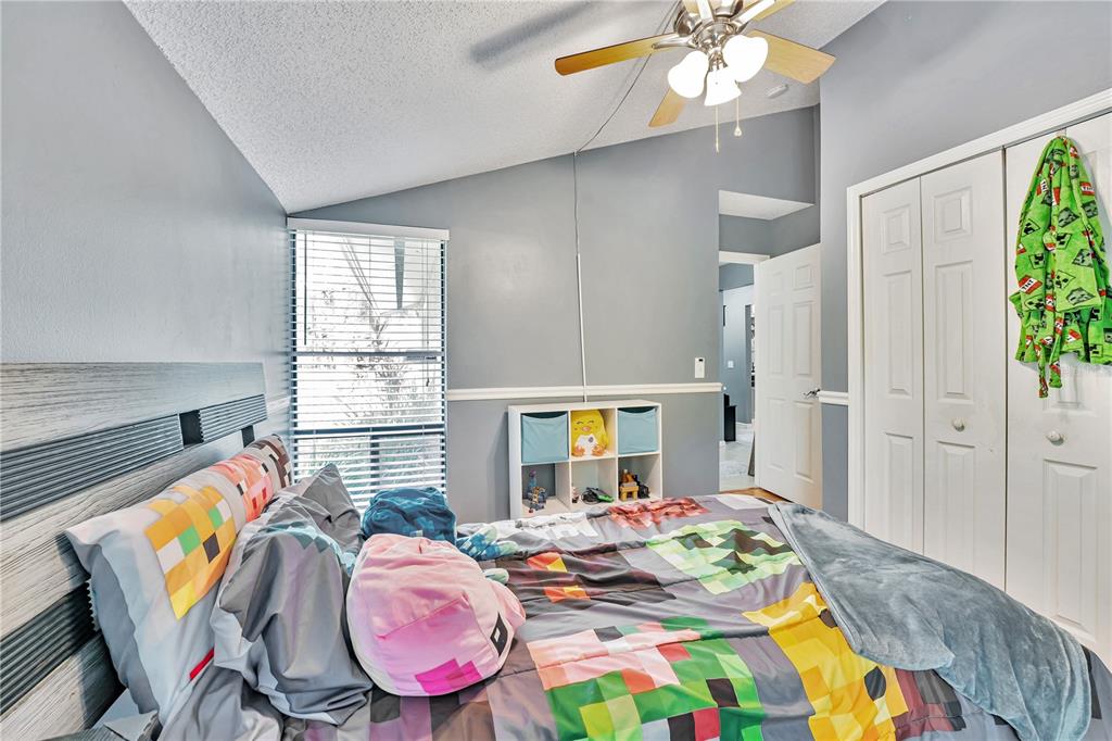 701 St Michael Lane Altamonte Springs, FL 32714 - Photo 11 of 19 a bedroom with bed and a window
