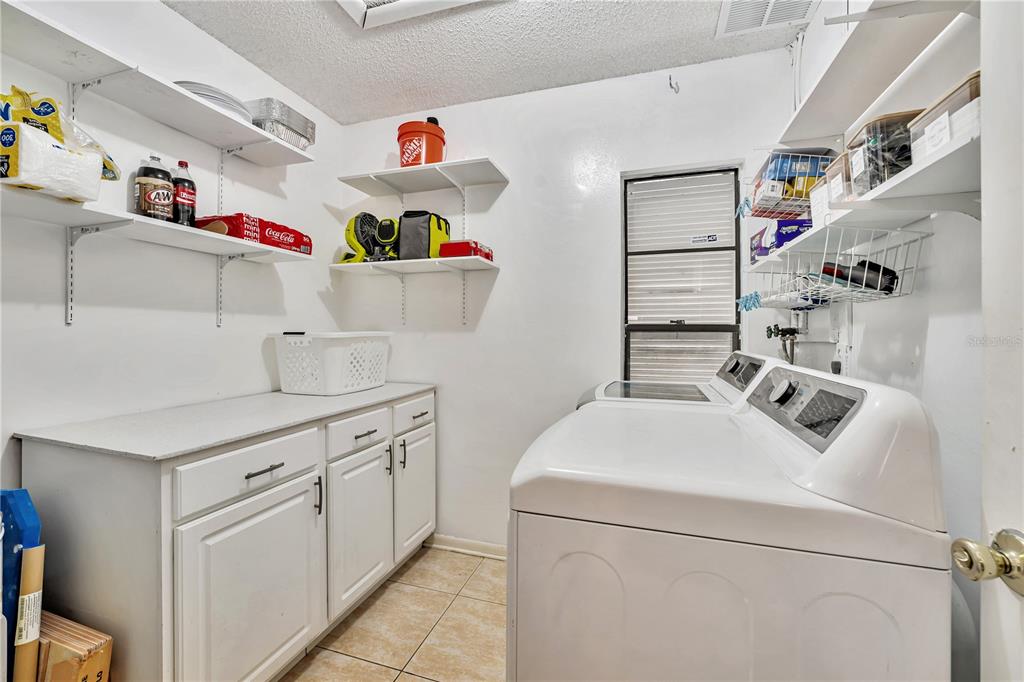 701 St Michael Lane Altamonte Springs, FL 32714 - Photo 15 of 19 a utility room with sink dryer and washer