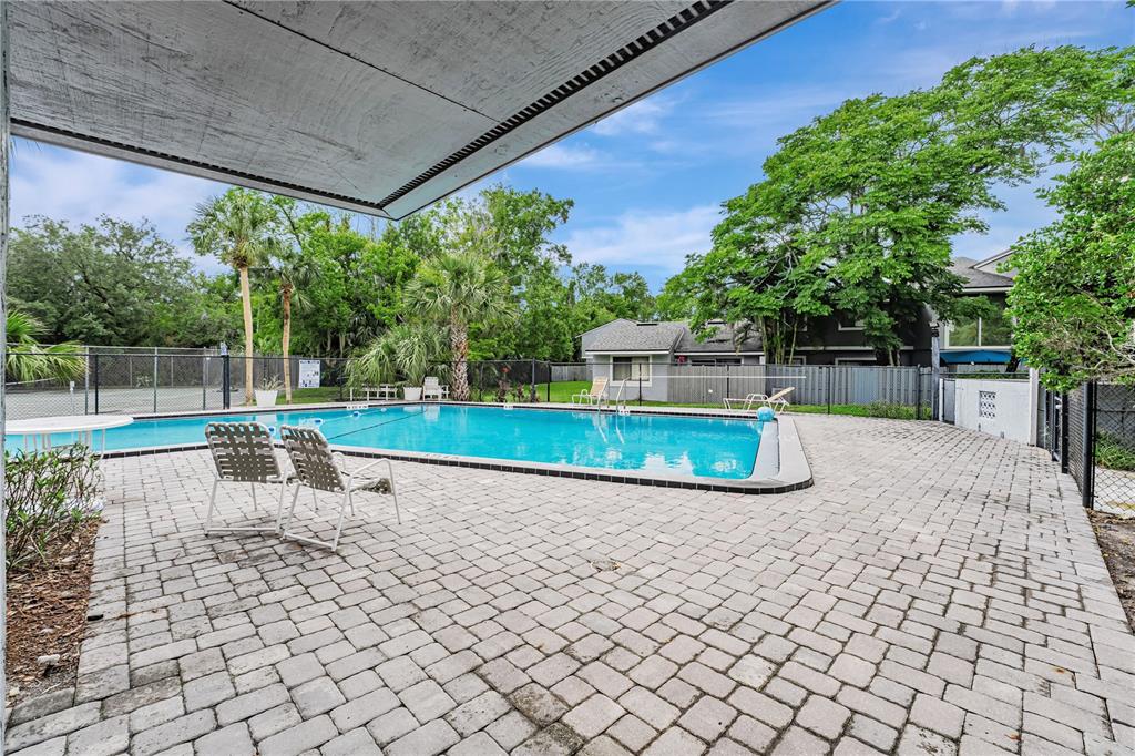 701 St Michael Lane Altamonte Springs, FL 32714 - Photo 18 of 19 a view of a chair and table on the terrace
