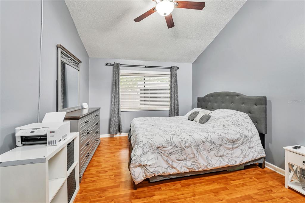 701 St Michael Lane Altamonte Springs, FL 32714 - Photo 6 of 19 a bedroom with a bed and wooden floor